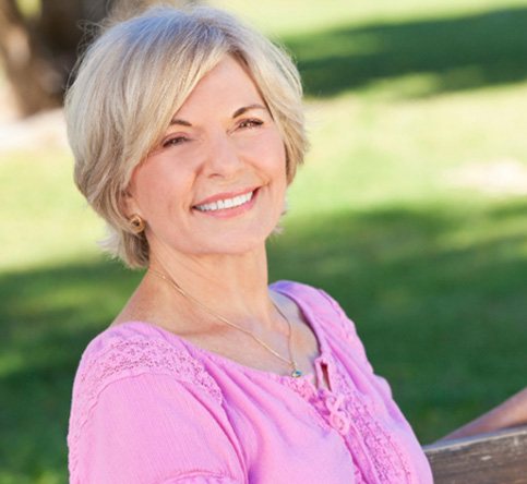 Confident senior woman enjoying the benefits of All-on-4 dentures