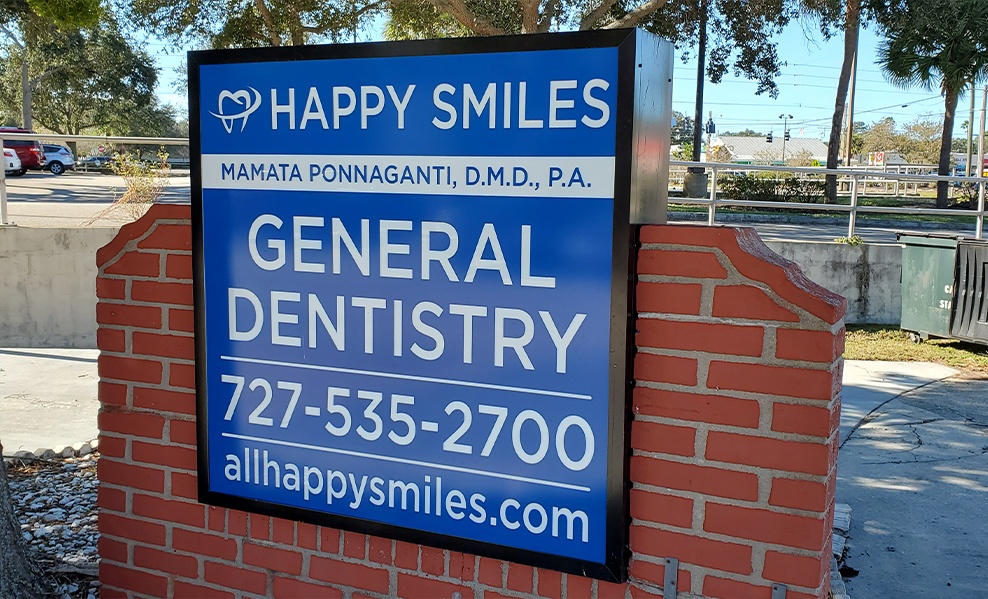 Happy Smiles dental office sign outdoors