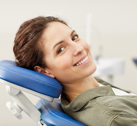 Woman smiling after visiting cosmetic dentist in Westchase, FL