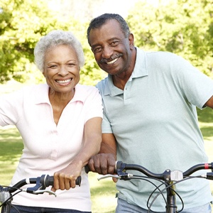Smiling couple with dental implants in Westchase