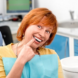 Woman smiling with dental implants in Westchase