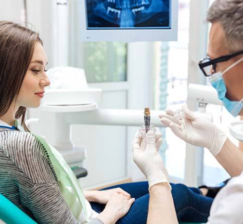 dentist explaining dental implant surgery in Westchase