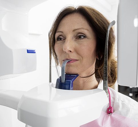 Woman receiving 3 D C T cone beam digital x-ray scan